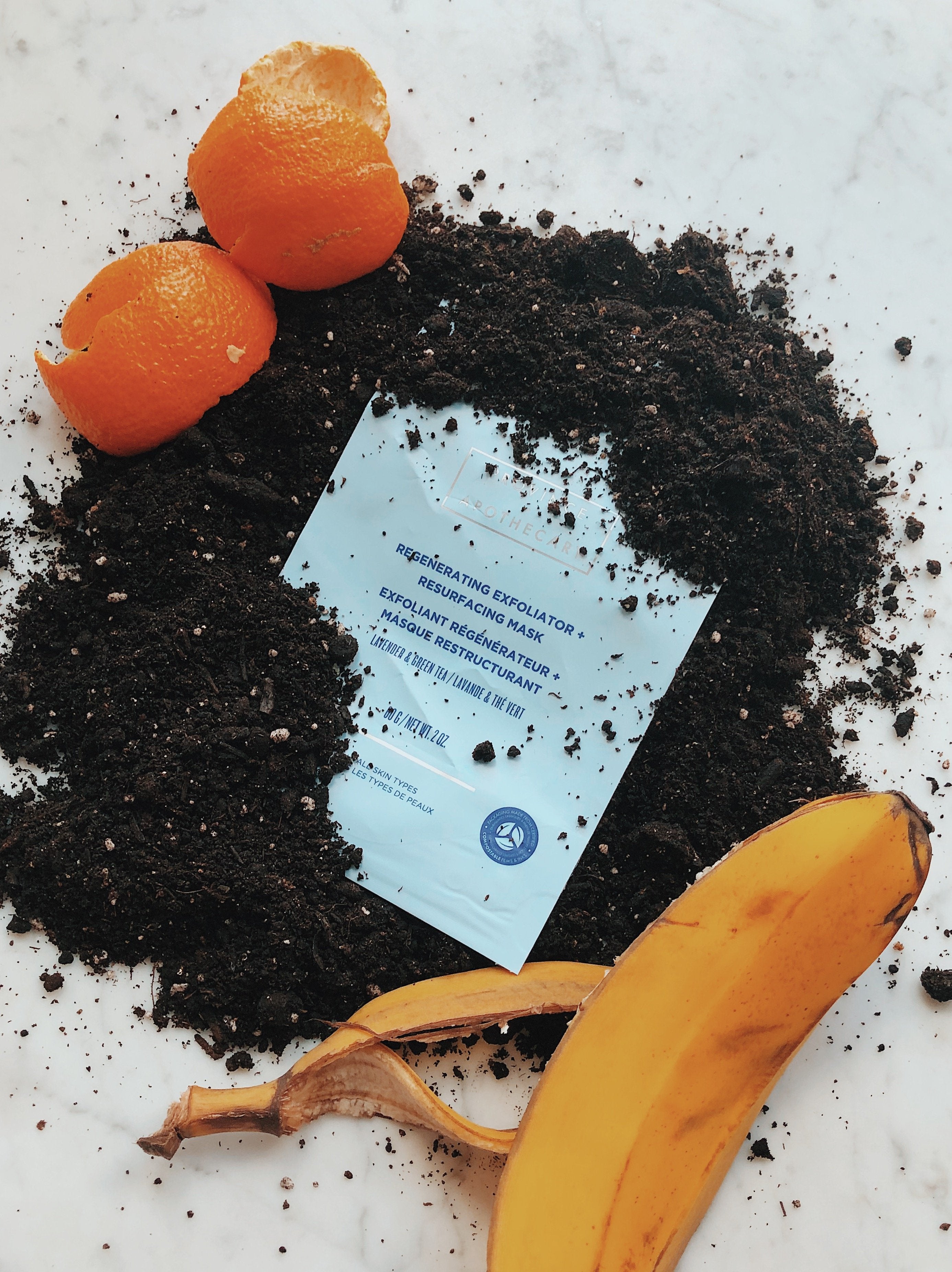 Province Apothecary compostable packaging shown with dirt, a banana peel and the skin of an orange.